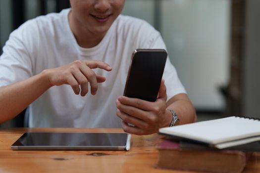 Man Completes KYC using an online banking app in order to open a digital savings account. The definition of cyber security.