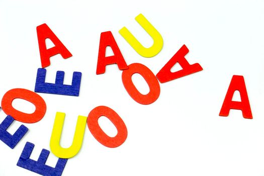 Many Multicolored vowels on white background