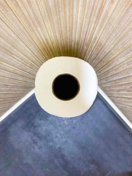 Symmetrical geometric abstract top view of toilet paper in a corner