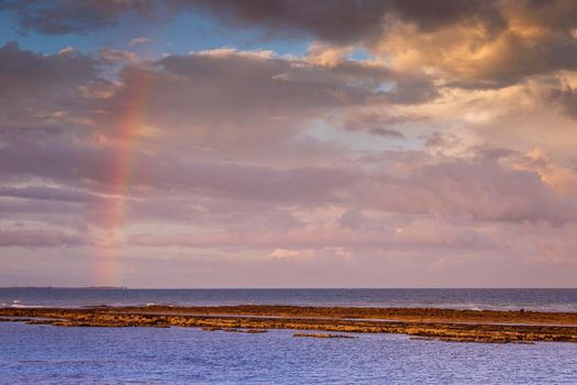 Idyllic Porto Seguro Beach at sunset with rainbow in BAHIA, Northeastern Brazil