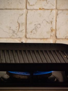 preparing a grill for cooking with heat and olive oil