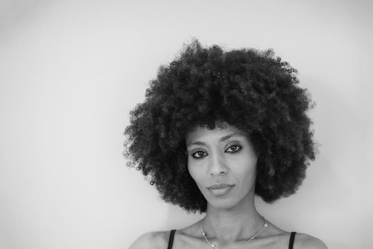 Young attractive African woman with happy cheerful smile having fun in studio