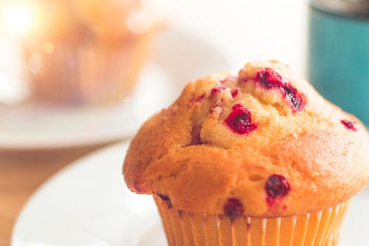 selective focus Blueberry muffins in a basket  baked blueberry muffins cooling with warm lighting