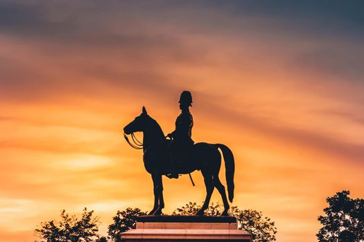 The Equestrian Statue of King Chulalongkorn Rama 5 riding horse over nature sunset sky background.