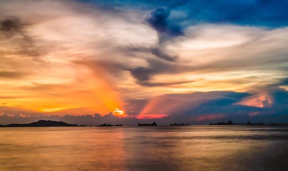 A golden sunrise or sunset over the ocean. Sunset, Sunrise Summer Landscape. Beautiful Nature.