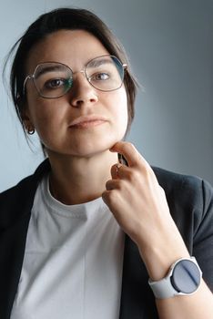 Portrait of a young mixed-race girl - looking thoughtfully at the camera. Not smiling. A new generation. Young mellifluous youth.