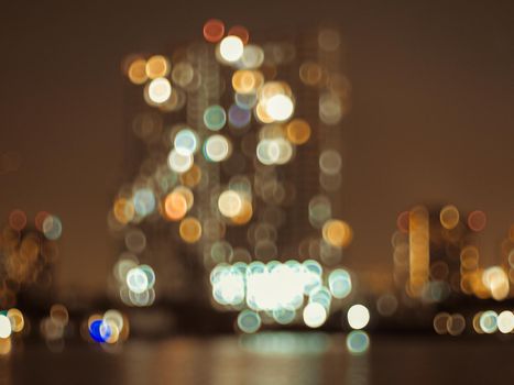 Defocus blur city night lights colorful bokeh abstract capital city architecture background.