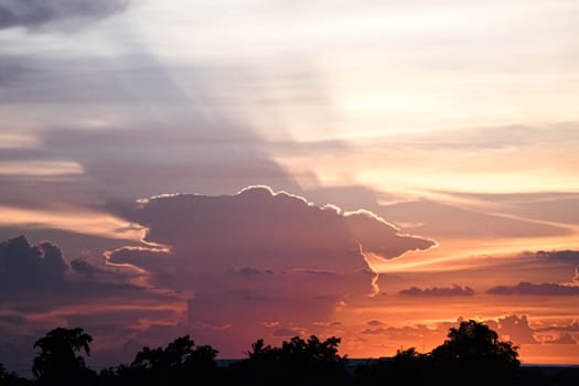 Beautiful sunset sky above clouds orange sunset sky. Beautiful sky. Dramatic red yellow pastel color at sunset.