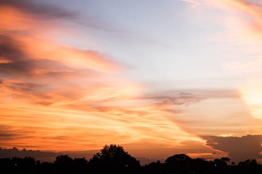 Beautiful sunset sky above clouds orange sunset sky. Beautiful sky. Dramatic red yellow pastel color at sunset.