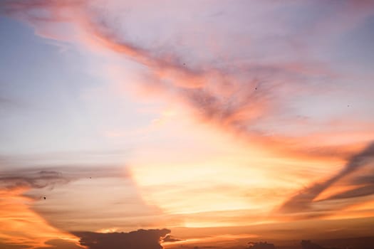 Beautiful sunset sky above clouds orange sunset sky. Beautiful sky. Dramatic red yellow pastel color at sunset.