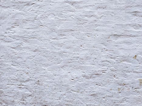 White textured stucco wall background. White stucco wall. Background of a white stucco coated and painted exterior, rough cast of cement and. White background. Abstract  wall grunge stone.