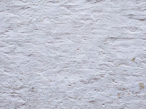 White textured stucco wall background. White stucco wall. Background of a white stucco coated and painted exterior, rough cast of cement and. White background. Abstract  wall grunge stone.