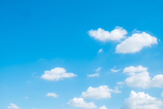 white fluffy clouds sky background with blue sky background for copy space.