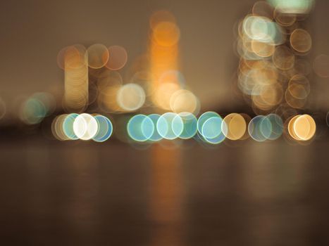 Defocus blur city night lights colorful bokeh abstract capital city architecture background.