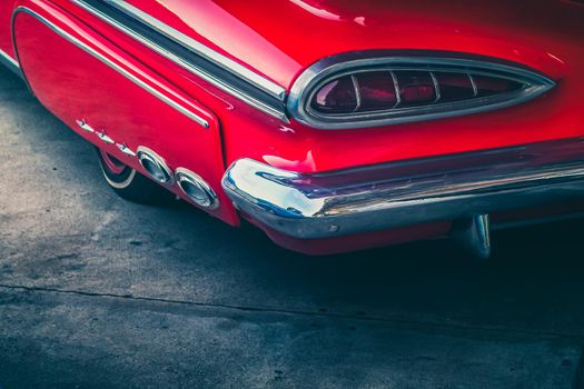 vintage classic car in a colorful street of old town. Travel and tourism concept.