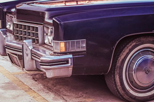 vintage classic car in a colorful street of old town. Travel and tourism concept.