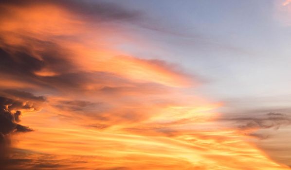 Beautiful sunset sky above clouds orange sunset sky. Beautiful sky. Dramatic red yellow pastel color at sunset.