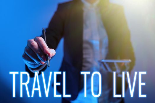 Hand writing sign Travel To Live, Word for Get knowledge and exciting adventures by going on trips Businessman With Tablet Pointing Digital S In Pattern And Information.