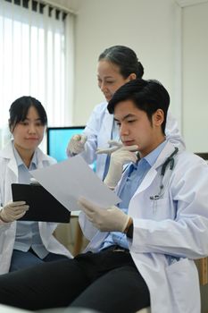 Biotechnology specialist team conducting experiment in a laboratory. Concepts of medicine and science researching.