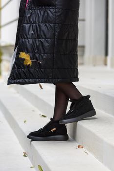 Female fashion shoes. Black boots with fur.