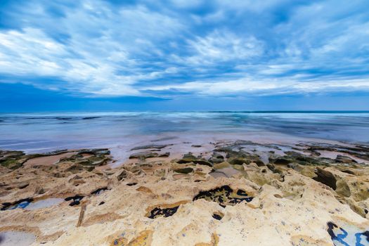 Boag Rocks at Gunnamatta Ocean Beach on a stormy afternoon in St Andrews Beach in Victoria, Australia