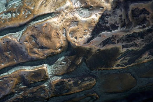 Bronze texture for backgrounds. Grunge metal background close-up. Selective focus