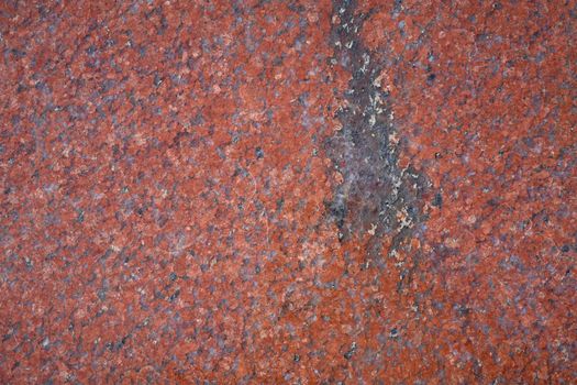 Background texture of polished red granite, close-up.. Abstract granite background for design