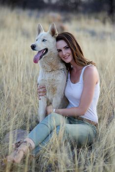 Hes more than a pet. Hes family. Portrait of an attractive young woman bonding with her dog outdoors