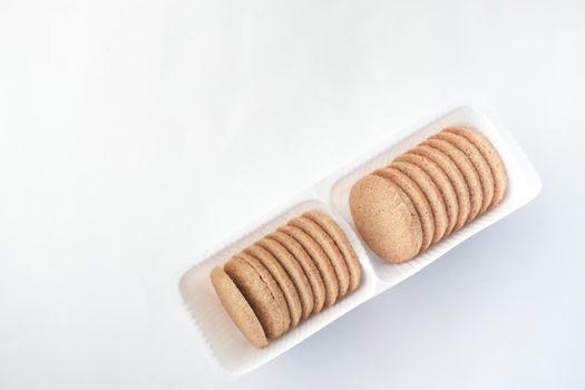 close up of cheese cookies in a packer on table .