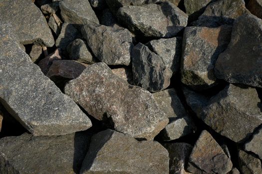 The texture of a large granite cobblestone as a background