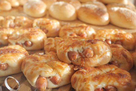 stack of fresh baked croissant with sausage .