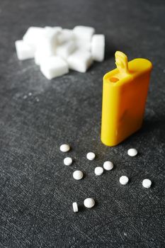 artificial sweetener container on table .