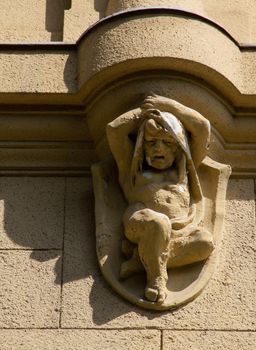 Eroded building sculpture child balcony support with shadow. High quality photo