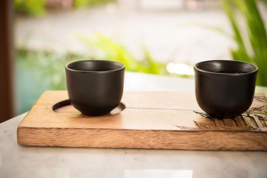 hand pour Chinese or Japanese traditional tea from clay pot