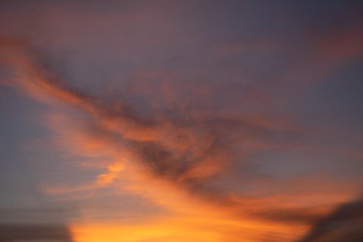 Beautiful sunset sky above clouds orange sunset sky. Beautiful sky. Dramatic red yellow pastel color at sunset.