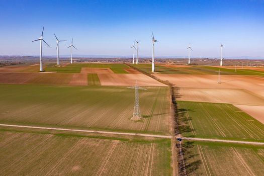 A rural area with a wind farm and electricity pylons for the energy transition, Germany