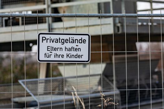 German note Parents are liable for their children at a site fence on private property