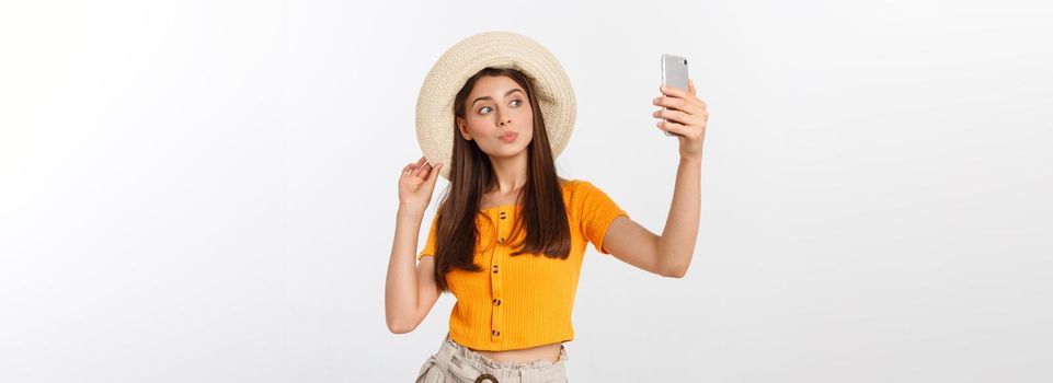 Young Caucasian woman enjoying the selfie with herself isolated on white background summer travel concept