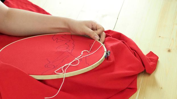 Woman hands and craft work. Embroider sewing by hand. Handicraft work by thread needle sew knit. Wood frame embroidery hoop. Needlework handicraft crafting quarantine leisure concept. 