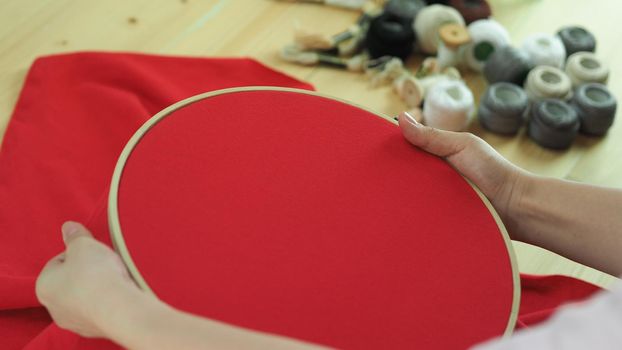 Woman hands and craft work. Embroider sewing by hand. Handicraft work by thread needle sew knit. Wood frame embroidery hoop. Needlework handicraft crafting quarantine leisure concept. 