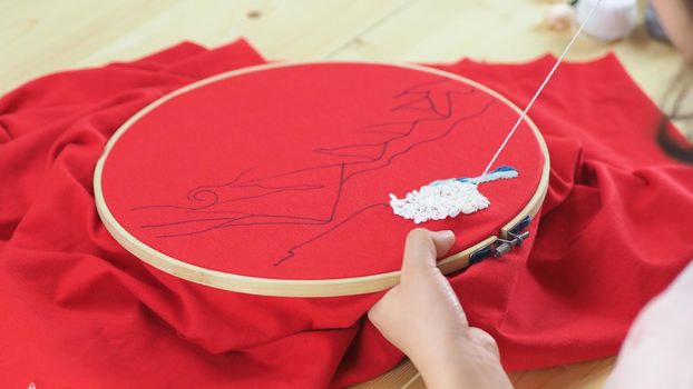 Woman hands and craft work. Embroider sewing by hand. Handicraft work by thread needle sew knit. Wood frame embroidery hoop. Needlework handicraft crafting quarantine leisure concept. 