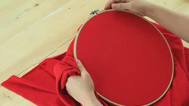 Woman hands and craft work. Embroider sewing by hand. Handicraft work by thread needle sew knit. Wood frame embroidery hoop. Needlework handicraft crafting quarantine leisure concept. 