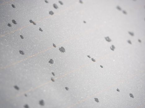 Start of rain. The first water drops on the heated rear window of the car 