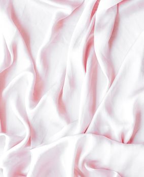 Elegant fabric texture, abstract backdrop and modern pastel colours concept - Pink soft silk waves, flatlay background