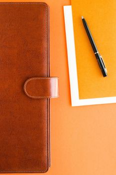 Modern workspace, productivity and corporate lifestyle concept - Luxury business brown brief-case on the office table desk, flatlay