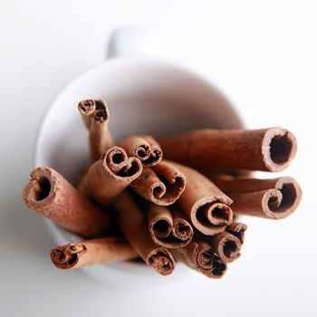 Smelly Cinnamon sticks in white cup, upside