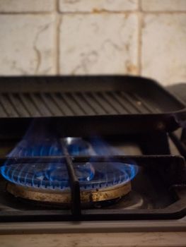 preparing a grill for cooking with heat and olive oil