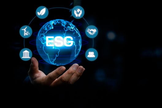 Businessman touching ESG Environmental Social Governance virtual screen Internet Business Technology Concept.