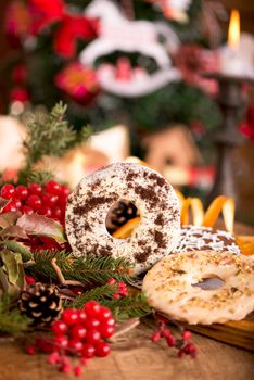 Christmas decoration with cookies and spices on an old wooden background.