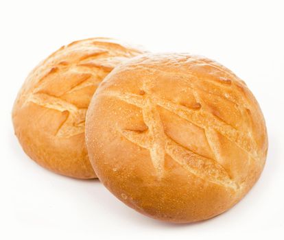 Homemade bread with raisins lie on a white background